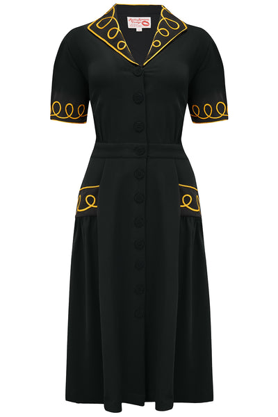 La robe chemise « Loopy-Lou » en noir avec contraste or RicRac, véritable style vintage des années 1950
