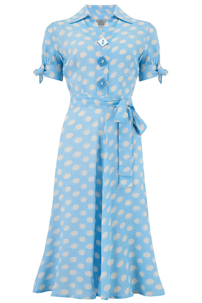 "Iris" Tea Dress in Blue Moonshine Print, Classic & Authentic 1940s Style at its Best - True and authentic vintage style clothing, inspired by the Classic styles of CC41 , WW2 and the fun 1950s RocknRoll era, for everyday wear plus events like Goodwood Revival, Twinwood Festival and Viva Las Vegas Rockabilly Weekend Rock n Romance The Seamstress Of Bloomsbury